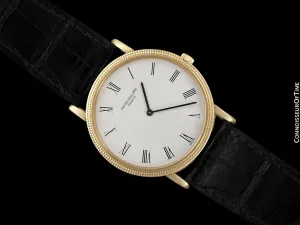Patek Philippe Calatrava Mens Handwound Ultra Thin Watch, Ref. 3520 - 18K Gold with Hobnail Bezel